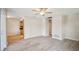 Open living room with wood-look flooring, neutral paint, and plenty of natural light, creating a welcoming space at 15202 Morning Dr, Lutz, FL 33559