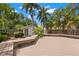 A backyard with a wooden deck, a shed, and lots of beautiful greenery at 1530 21St N Ave, St Petersburg, FL 33704
