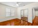 Inviting bedroom featuring hardwood floors, a ceiling fan, and sliding closet doors at 1530 21St N Ave, St Petersburg, FL 33704