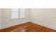 Cozy bedroom showcases original hardwood floors and classic white trim at 1530 21St N Ave, St Petersburg, FL 33704
