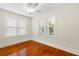 Sun-filled bedroom boasting hardwood floors, fresh paint, and dual windows at 1530 21St N Ave, St Petersburg, FL 33704