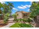 An exterior of the home with a wooden deck and lush, tropical landscaping at 1530 21St N Ave, St Petersburg, FL 33704