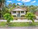 Charming bungalow with inviting front porch, lush landscaping, and a picket fence at 1530 21St N Ave, St Petersburg, FL 33704