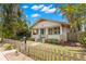 Attractive single-story home boasting a well-kept lawn and a classic picket fence at 1530 21St N Ave, St Petersburg, FL 33704