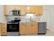 A bright kitchen with stainless steel appliances and light wood cabinetry at 1530 21St N Ave, St Petersburg, FL 33704