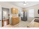 A vintage kitchen with a stainless steel refrigerator, tile floors, and cabinets at 1530 21St N Ave, St Petersburg, FL 33704