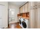 Functional laundry room with ample cabinet space, tile accents, and modern washer/dryer units at 1530 21St N Ave, St Petersburg, FL 33704