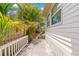 A shady side yard with a stone walkway alongside the home at 1530 21St N Ave, St Petersburg, FL 33704
