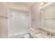 This bathroom features a tub and shower combination, granite countertop and vanity at 15801 Cottontail Pl, Tampa, FL 33624