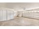 Spacious garage featuring laundry, overhead door and plenty of storage at 15801 Cottontail Pl, Tampa, FL 33624