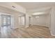Spacious living room with wood flooring and neutral paint, showcasing the home's open layout at 15801 Cottontail Pl, Tampa, FL 33624