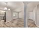 Open-concept living space featuring wood floors and kitchen area with stainless-steel appliances at 15801 Cottontail Pl, Tampa, FL 33624