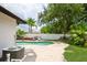Inviting backyard pool featuring a spacious patio, lounge chairs, and lush landscaping, perfect for relaxation at 15801 Cottontail Pl, Tampa, FL 33624