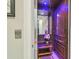 Residential elevator with wood paneling and decorative lighting at 17 Franklin S Ct # C, St Petersburg, FL 33711