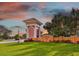 Inviting community entrance featuring lush landscaping, a decorative sign, and an elegant architecture, showcasing curb appeal at 17 Franklin S Ct # C, St Petersburg, FL 33711