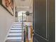 Grand foyer showcasing an elegant staircase with wooden banister and a view into the home's interior at 17 Franklin S Ct # C, St Petersburg, FL 33711