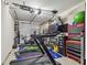 Garage as a fitness center with treadmill, stationary bike, weights, and a TV for entertainment during workouts at 17 Franklin S Ct # C, St Petersburg, FL 33711