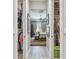 Hallway view through open closet doors, leading into an inviting bedroom with natural light at 17 Franklin S Ct # C, St Petersburg, FL 33711