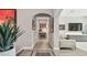 Elegant hallway with decorative art and an open view towards the living area, creating a seamless flow at 17 Franklin S Ct # C, St Petersburg, FL 33711