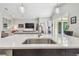 Bright, modern kitchen featuring a stainless steel sink and countertop at 17 Franklin S Ct # C, St Petersburg, FL 33711