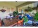 Cozy lanai with a mix of seating and dining areas, complemented by a variety of decorative plants at 17 Franklin S Ct # C, St Petersburg, FL 33711