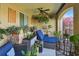 Relaxing lanai with chaise lounge, chairs, and lush plants creating a peaceful outdoor retreat at 17 Franklin S Ct # C, St Petersburg, FL 33711