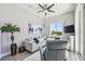 Comfortable living room featuring a plush sofa, accent pillows, and a large window for natural light at 17 Franklin S Ct # C, St Petersburg, FL 33711
