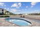 Relaxing community spa overlooking a serene lake with a fountain, offering a tranquil retreat in a picturesque setting at 17 Franklin S Ct # C, St Petersburg, FL 33711