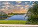Scenic water view featuring a fountain, lush greenery, and glimpses of nearby homes under a partly cloudy sky at 17 Franklin S Ct # C, St Petersburg, FL 33711