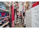 Spacious walk-in closet with custom shelving and ample storage for clothes, shoes, and accessories at 18827 Henequen Lane, Spring Hill, FL 34610