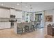 Bright, open kitchen featuring granite countertops, pendant lighting, and a seamless flow to the dining area at 18827 Henequen Lane, Spring Hill, FL 34610