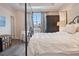Bright bedroom with a canopy bed, a dark wardrobe, and a window that provides natural light at 18827 Henequen Lane, Spring Hill, FL 34610