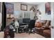 Inviting home office with a comfortable leather sofa, large window, and ample space for a workspace at 18827 Henequen Lane, Spring Hill, FL 34610
