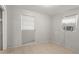 Bright bedroom features tile flooring, and two windows with an air conditioning unit at 2038 16Th S St, St Petersburg, FL 33705