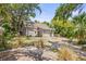 Charming single-story home featuring a lattice-enclosed porch and mature trees at 2038 16Th S St, St Petersburg, FL 33705