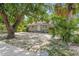 Charming single-story home with simple front facade, surrounded by lush greenery and mature trees at 2038 16Th S St, St Petersburg, FL 33705