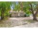 Charming single-story home with simple front facade, surrounded by lush greenery and mature trees at 2038 16Th S St, St Petersburg, FL 33705