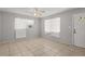 Bright living room featuring tiled floor and a ceiling fan, awaiting your personal touch and decoration at 2038 16Th S St, St Petersburg, FL 33705
