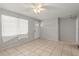 Bright living room with tiled floor, ceiling fan and neutral paint, ready for your personal touch at 2038 16Th S St, St Petersburg, FL 33705