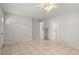 Bright living room with tiled floor, ceiling fan and neutral paint, ready for your personal touch at 2038 16Th S St, St Petersburg, FL 33705