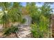 Outdoor shed surrounded by lush landscaping, offering potential for storage or a hobby space at 2038 16Th S St, St Petersburg, FL 33705