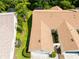 Overhead view of the home showcasing a well-maintained roof, lawn and landscaping at 21209 Diamonte Dr, Land O Lakes, FL 34637