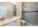 This bathroom showcases a modern glass shower, a sleek vanity, and contemporary fixtures and lighting at 21209 Diamonte Dr, Land O Lakes, FL 34637