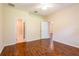 This spacious bedroom features beautiful hardwood floors, ceiling fan, and ensuite bathroom and closet access at 21209 Diamonte Dr, Land O Lakes, FL 34637