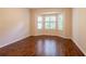 Bright bedroom with hardwood floors and bay window with plantation shutters at 21209 Diamonte Dr, Land O Lakes, FL 34637