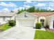 Charming single-story home with a two car garage and lovely curb appeal at 21209 Diamonte Dr, Land O Lakes, FL 34637