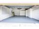 Large garage features freshly painted walls, sealed floor and custom cabinets for optimal storage at 21209 Diamonte Dr, Land O Lakes, FL 34637