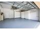 Large garage features freshly painted walls, sealed floor and custom cabinets for optimal storage at 21209 Diamonte Dr, Land O Lakes, FL 34637
