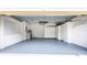 Large garage features freshly painted walls, sealed floor and custom cabinets for optimal storage at 21209 Diamonte Dr, Land O Lakes, FL 34637
