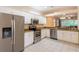 This modern kitchen offers stainless steel appliances, granite counters, and an open layout at 21209 Diamonte Dr, Land O Lakes, FL 34637